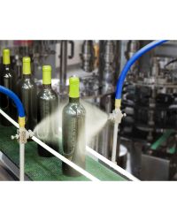 (2) Model EB1030SS atomizing nozzles are used to give a final sanitary rinse prior to labeling wine bottles.