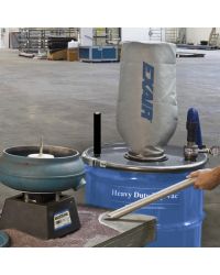 Heavy Duty Dry Vac vacuums up abrasive garnet from the work surface surrounding a vibratory bowl used to deburr parts.