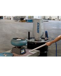 Heavy Duty Dry Vac vacuums up abrasive garnet from the work surface surrounding a vibratory bowl used to deburr parts.