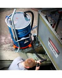 This Premium High Lift Reversible Drum Vac is removing used coolant from a deep pit.